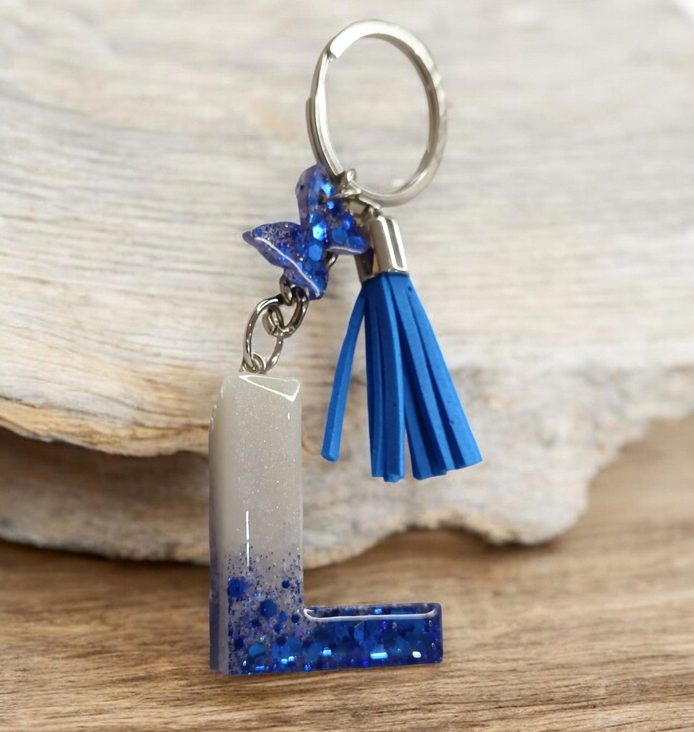 Haute Crafts Shiny Glittery Blue & Pearl White ("L")- with small Butterfly & Tassel, Resin Alphabet Initial Letter Keychain Key Ring for Women Girls Purse Handbags, Bike, Car Keyring ("L")