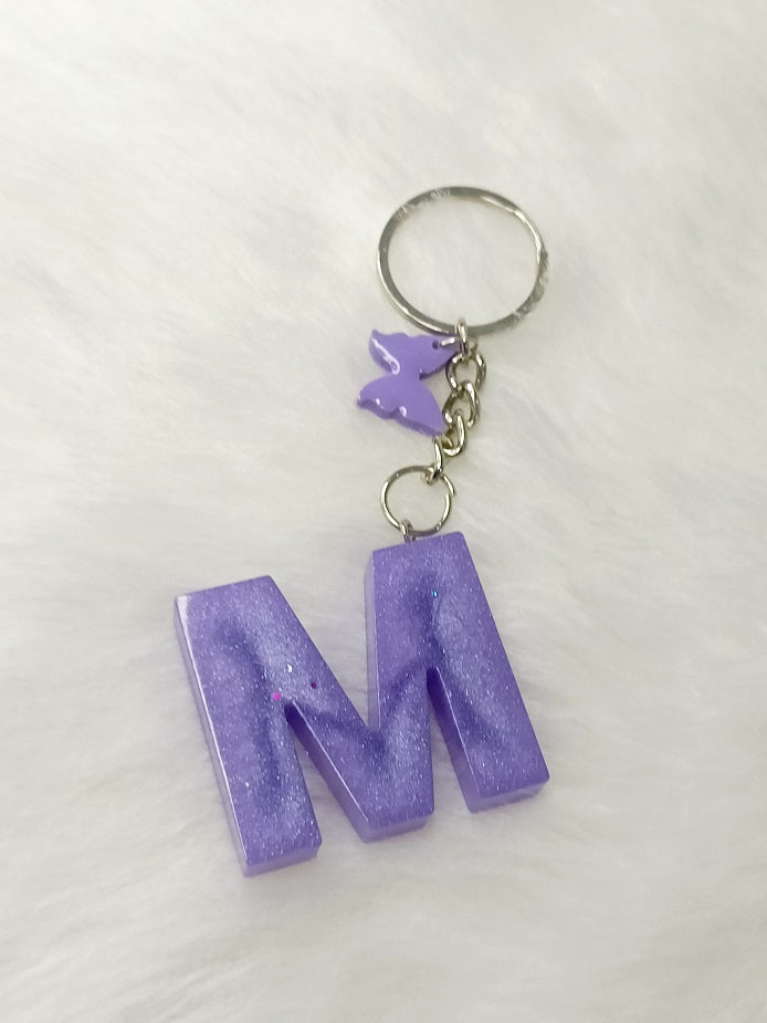 Haute Crafts Glass Shiny Purple ("M")- with small Butterfly, Resin Alphabet Initial Letter Keychain Key Ring for Women Girls Purse Handbags, Bike, Car Keyring ("M")