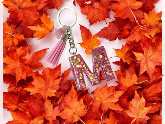 Haute Crafts Giltery Shiny Pink ("M")- with small Butterfly& Tassel, Resin Alphabet Initial Letter Keychain Key Ring for Women Girls Purse Handbags, Bike, Car Keyring ("M")