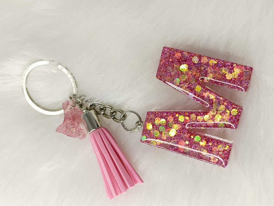 Haute Crafts Giltery Shiny Pink ("M")- with small Butterfly& Tassel, Resin Alphabet Initial Letter Keychain Key Ring for Women Girls Purse Handbags, Bike, Car Keyring ("M")