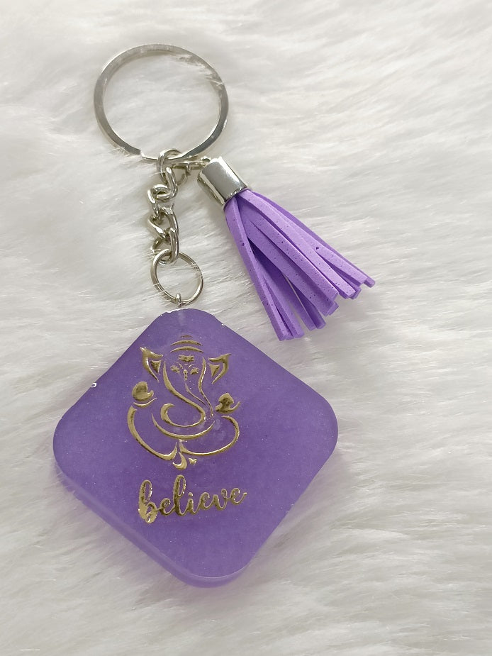 Haute Crafts "Ganesh ji "Theme with Tassel ,Resin Keychain Key Ring for Women, Girls Purse ,Handbags, Car, Bike.