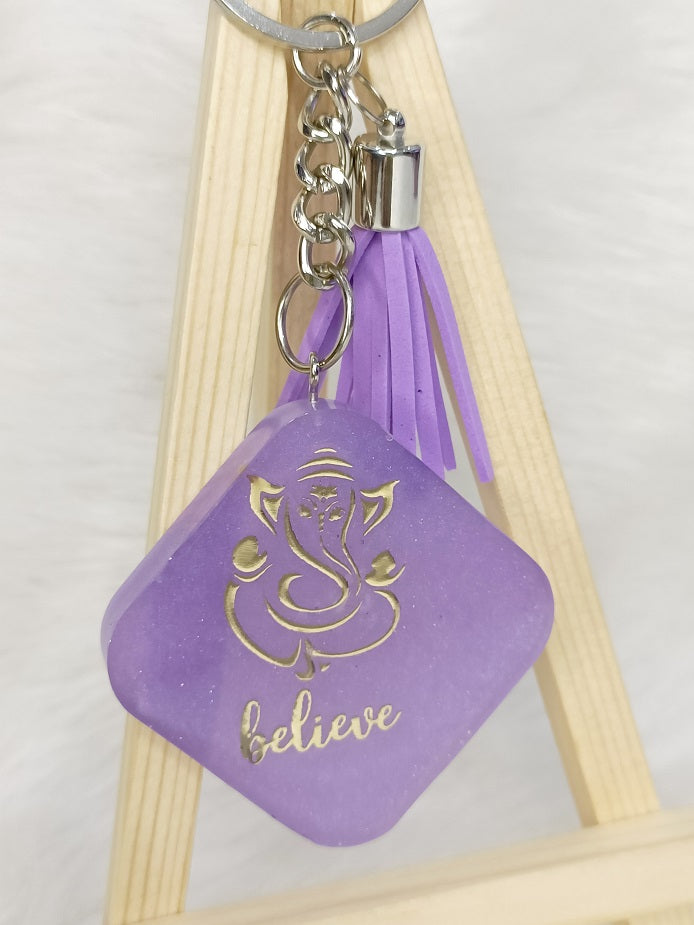 Haute Crafts "Ganesh ji "Theme with Tassel ,Resin Keychain Key Ring for Women, Girls Purse ,Handbags, Car, Bike.