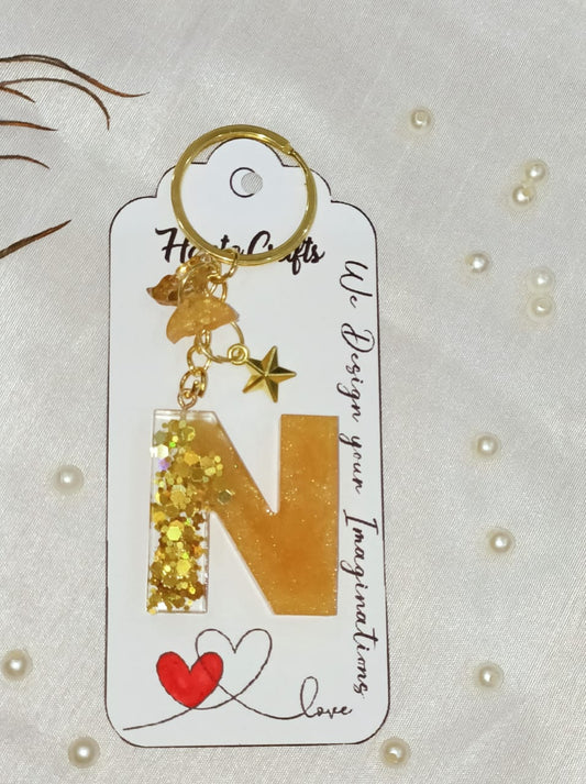 Haute Crafts Shiny Glittery Golden ("N")- with Golden star & Butterfly, Resin Alphabet Initial Letter Keychain Key Ring for Women Girls Purse Handbags, Bike, Car Keyring, Home, Small Gifts, ("N")