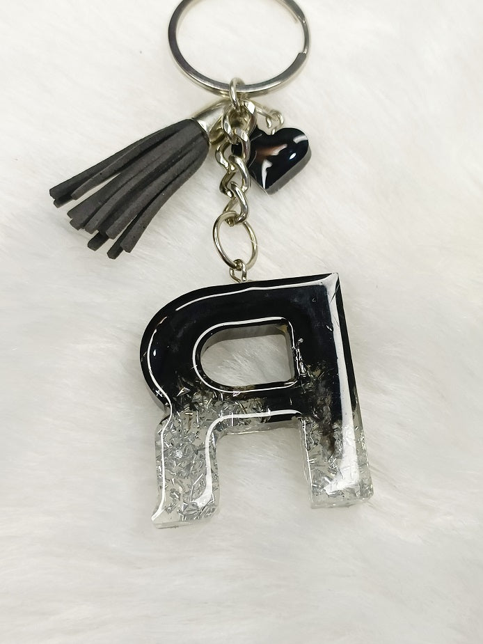 Haute Crafts Shiny Black & Silver ("R")- with small Heart & Tassel, Resin Alphabet Initial Letter Keychain Key Ring for Women Girls Purse Handbags, Bike, Car Keyring ("R")